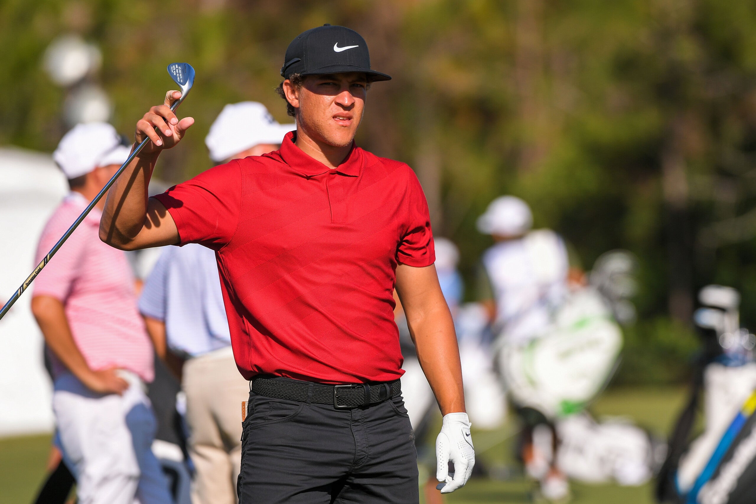Golfers wore red and black in honor of Tiger Woods during Sunday's play ...