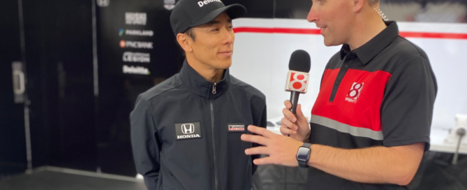 Two-time Indianapolis 500 champion Takuma Sato, right, talks with News 8's Andrew Chernoff at Indianapolis Motor Speedway on May 28, 2023. (WISH Photo