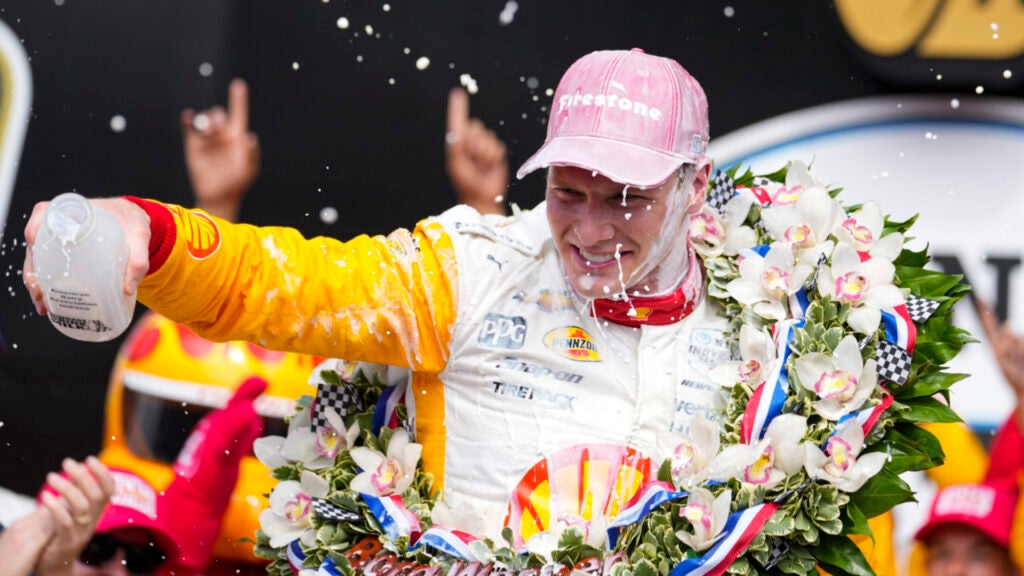 Josef Newgarden celebrates after winning the Indianapolis 500 auto race at Indianapolis Motor Speedway in Indianapolis, Sunday, May 28, 2023. (AP Photo/Michael Conroy)