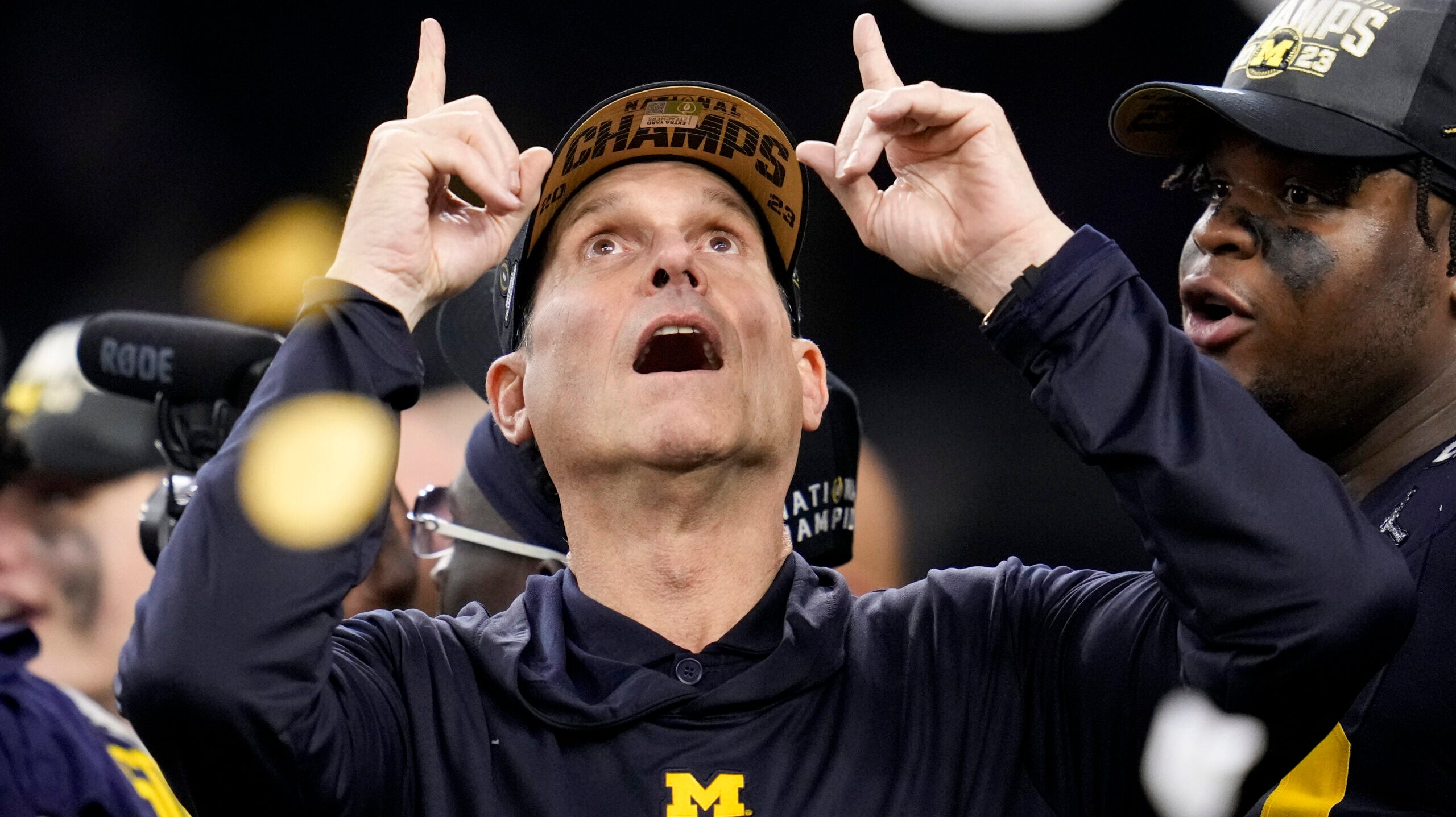 Back to the NFL: Chargers hire Jim Harbaugh after Michigan wins
national title