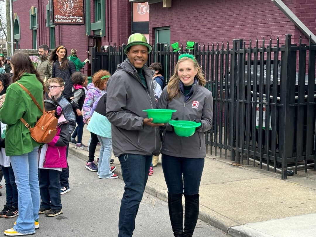 Daybreak's Jeremy Jenkins and Hanna Mordoh smile for the camera after walking in the annual St. Patrick's Day Parade in downtown Indianapolis on March 15, 2024. (WISH Photo/Hanna Mordoh)