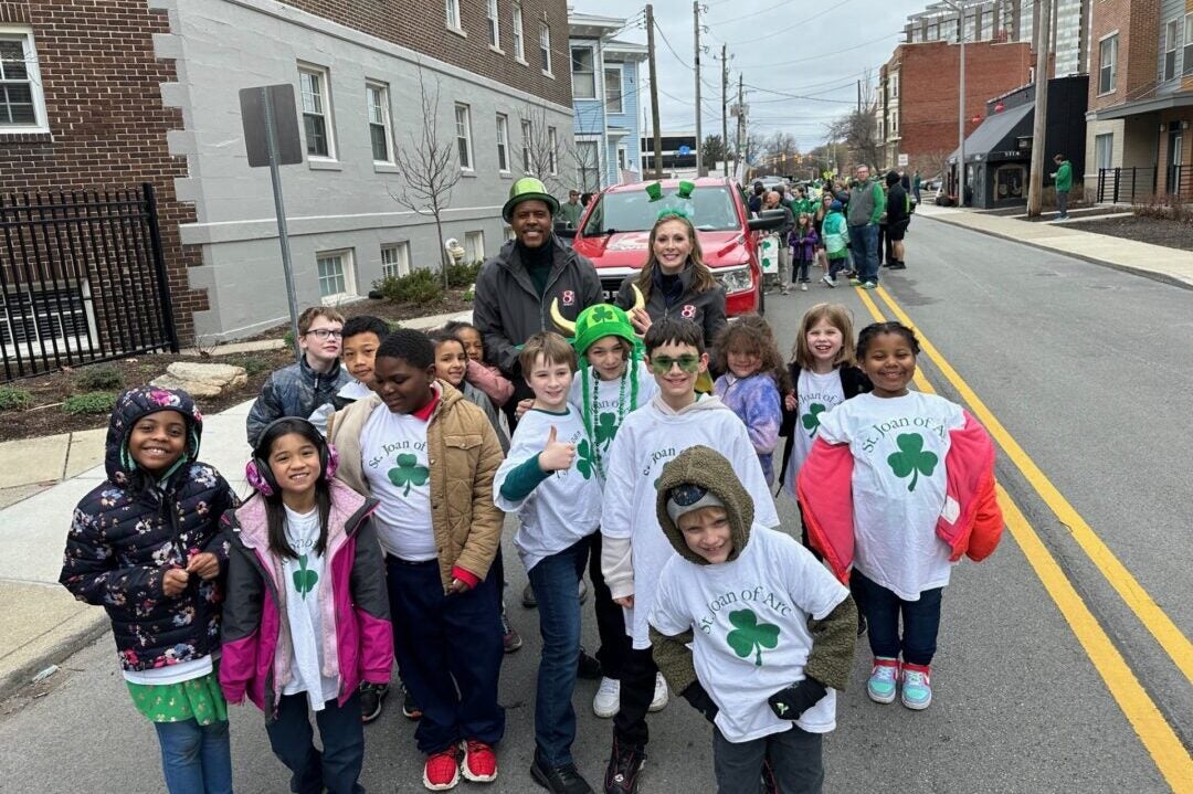 Daybreak's Hanna Mordoh and Jeremy Jenkins enjoy a moment with some adorable youngsters from St, Joan of Arc Catholic School after the annual St. Patrick's Day Parade in downtown Indianapolis on March 15, 2024. (WISH Photo/Hanna Mordoh)