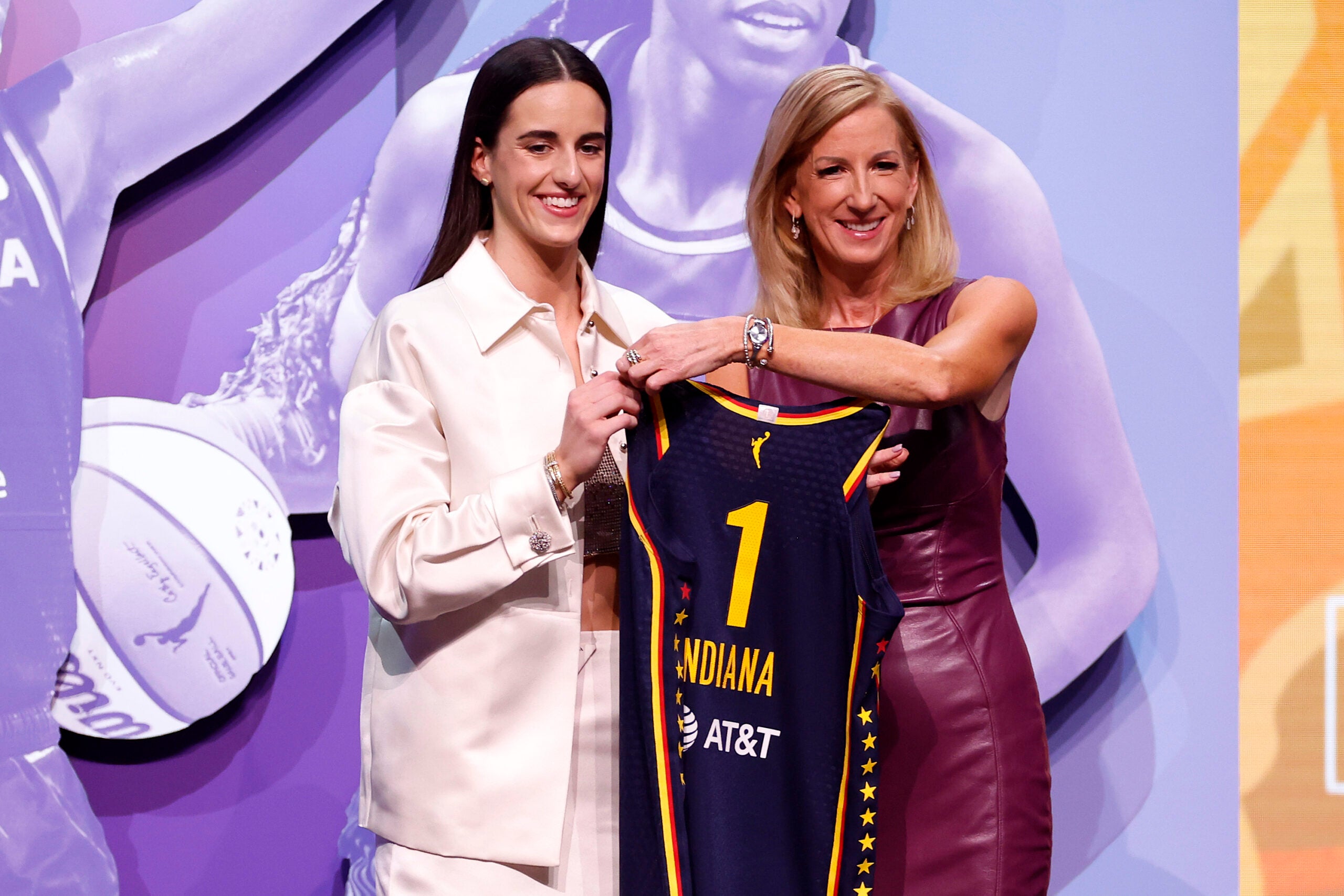 Caitlin Clark poses with WNBA Commissioner Cathy Engelbert after being selected first overall pick by the Indiana Fever during the 2024 WNBA Draft at Brooklyn Academy of Music on April 15, 2024 in New York City. (Photo by Sarah Stier/Getty Images)