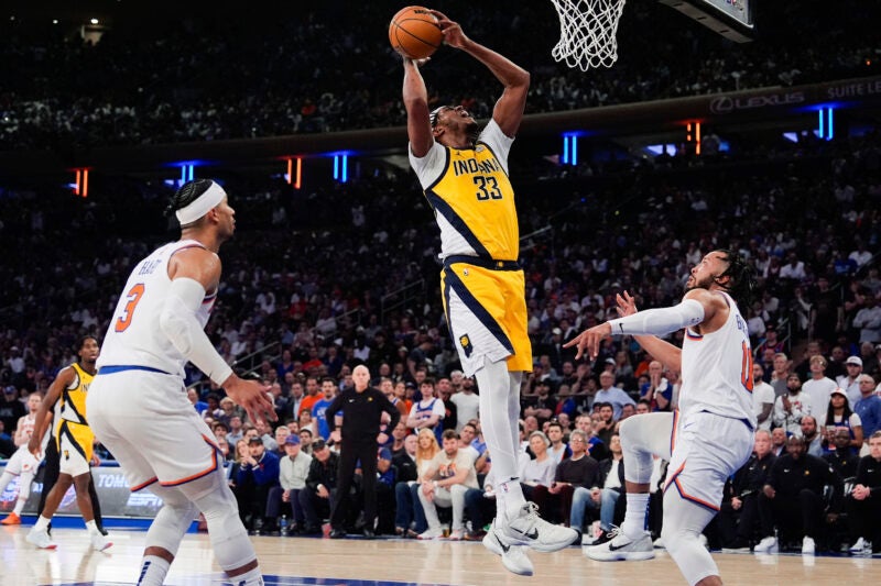 New York Knicks guards Josh Hart (3) and Jalen Brunson look on as Indiana Pacers center Myles Turner (33) shoots during the first half of Game 7 in an NBA basketball second-round playoff series, Sunday, May 19, 2024, in New York. (AP Photo/Julia Nikhinson)